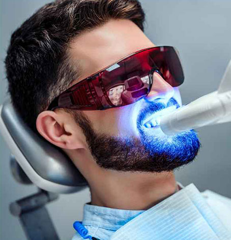 man getting cosmetic dentistry procedure done
