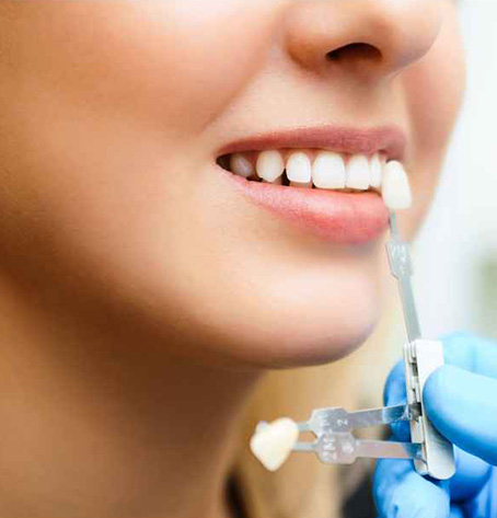 woman checking teeth sample